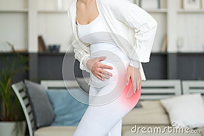 Hip pain, woman suffering from osteoarthritis at home Stock Photo