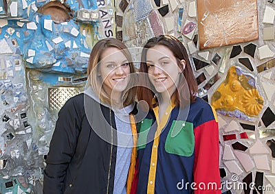 Hip seventeen yearold girl and her forty-five yearold mother posing in the Magic Garden of Isaiah Zagar, Philadelphia Editorial Stock Photo