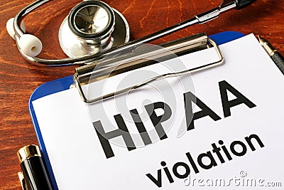 HIPAA violation form on a clipboard. Stock Photo