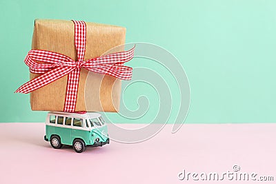 Hippie Bus with New Year Christmas Present on the Roof Miniature Small Car Stock Photo