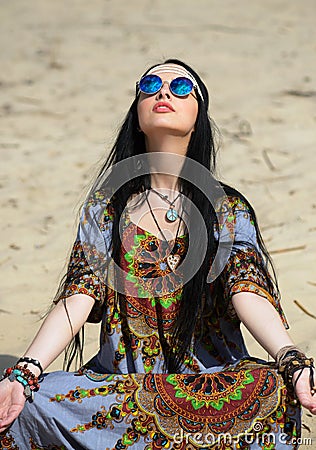 Hippie girl meditates Stock Photo