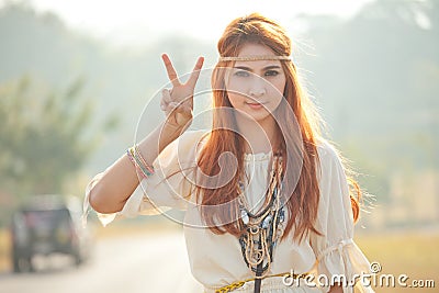 Hippie girl with peace signs Stock Photo