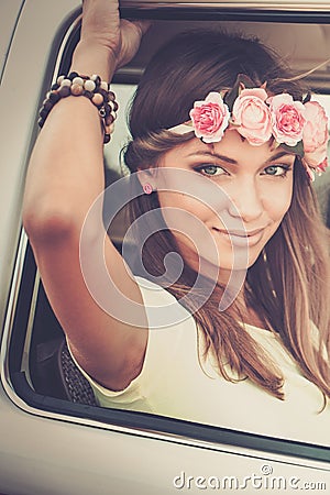 Hippie girl in a van Stock Photo