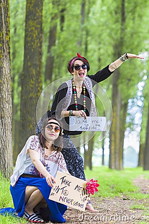 Hippie Girls Hitchhiking Editorial Stock Photo