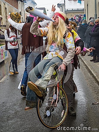 Hippie riding a bike and spreading love and peace Editorial Stock Photo
