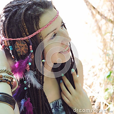 Hippie style young woman with dreadlocks portrait, outdoor Stock Photo