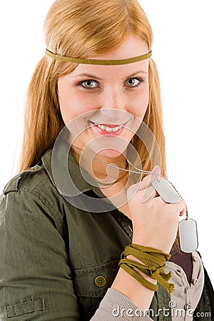 Hippie young woman in khaki outfit hold dog-tag Stock Photo