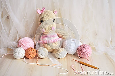 Hippopotamus crochet Vintage background Toy for kids Hippo knitting Handmade Hippie soft toy Cute woolen Hippie baby for children Stock Photo