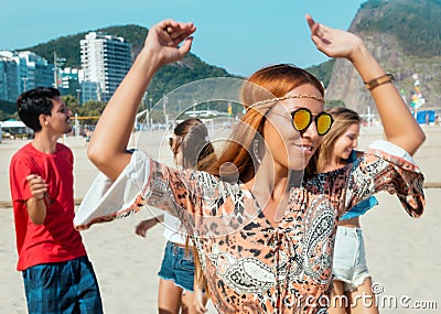 Hippy girl with group of man and woman at open air festival Stock Photo