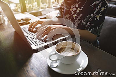 Hipster asian woman using laptop in the cafe Stock Photo