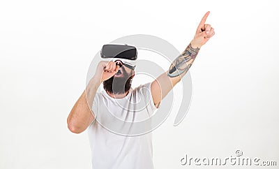 Hipster on busy face use modern technologies for entertainment or education. Man with beard in VR glasses, white Stock Photo
