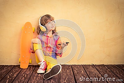 Hipster child with skateboard Stock Photo