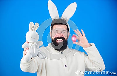 Hipster cute bunny long ears blue background. Easter bunny. Funny bunny with beard and mustache. Join celebration Stock Photo