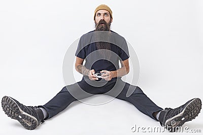 Hipster with a game controller on the floor Stock Photo