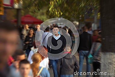 Hipster guy walking down the street, urban style Stock Photo