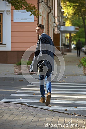 Hipster guy walking down the street, urban style Stock Photo