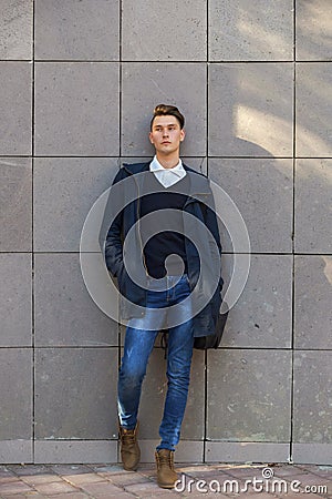 Hipster guy walking down the street, urban style Stock Photo