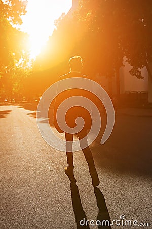 Hipster guy walking down the street, urban style Stock Photo