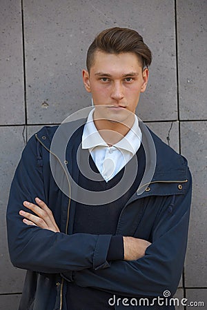 Hipster guy walking down the street, urban style Stock Photo