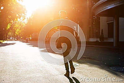 Hipster guy walking down the street, urban style Stock Photo