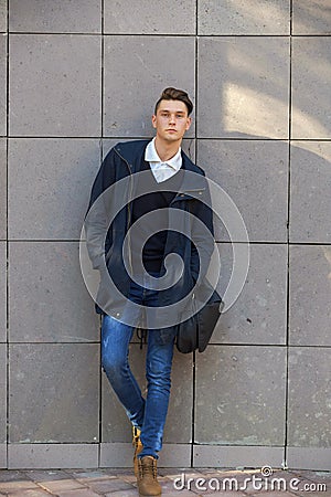 Hipster guy walking down the street, urban style Stock Photo