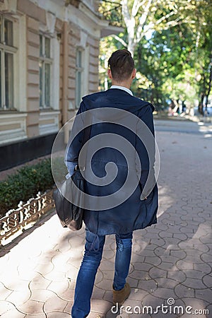 Hipster guy walking down the street, urban style Stock Photo