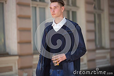 Hipster guy walking down the street, urban style Stock Photo