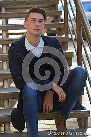 Hipster guy walking down the street, urban style Stock Photo