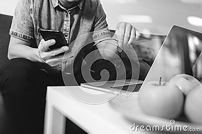 hipster hand using laptop compter and mobile payments online bus Stock Photo