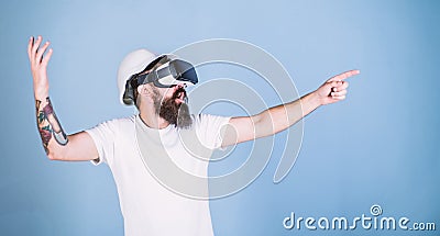 Hipster in helmet works as engineer in virtual reality. 3D design concept. Architect or engineer with virtual reality Stock Photo