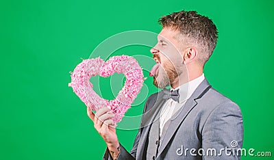 Hipster hold heart symbol love. Bring love to family holiday. Romantic surprise. Man in love strict wear formal suit Stock Photo