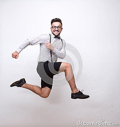 Hipster man jumping in photo studio Stock Photo