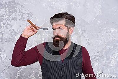 Hipster shave face with blade. confident man beard. brutal hairdresser master. bearded barber ready for shaving Stock Photo