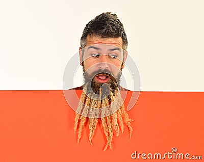 Hipster with shocked face in autumn nature looks down. Stock Photo