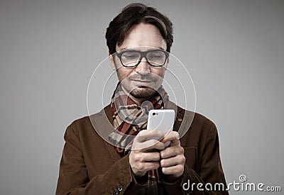 Hipster style man typing on smartphone Stock Photo