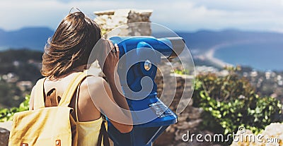 Hipster tourist look observant binoculars telescope on panoramic view, lifestyle concept trip, traveler with backpack on back Stock Photo