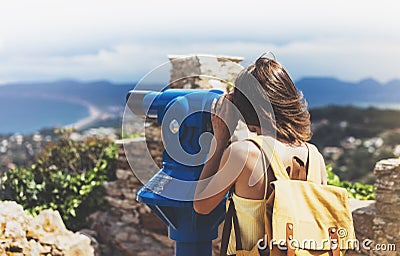 Hipster tourist look observant binoculars telescope on panoramic view, lifestyle concept trip, traveler with backpack on backgroun Stock Photo