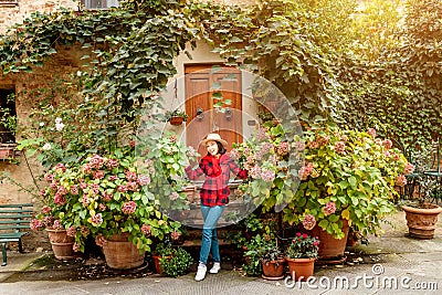 Hipster traveller woman posing in old town of Pienza, Tuscany Stock Photo
