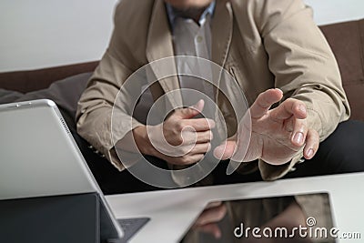 hipster using digital tablet computer on table and sitting on so Stock Photo