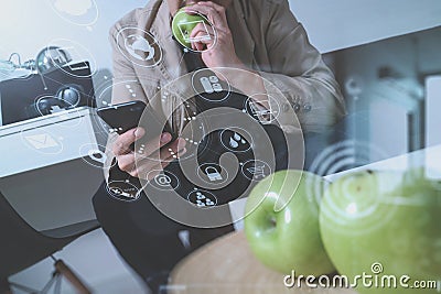 hipster using smart phone and digital tablet computer and holding credit card payments online business,sitting on sofa in living Stock Photo