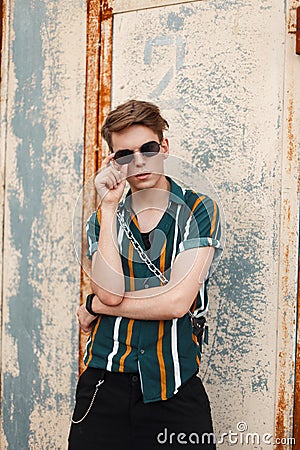 Hipster young stylish man in a fashion beach beautiful shirt Stock Photo