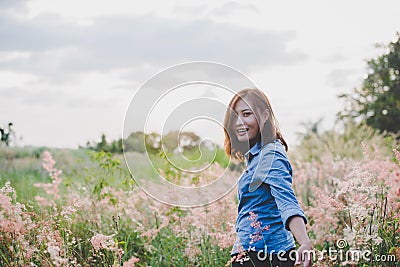 Hipster young woman guiding traveler into the field. Stock Photo