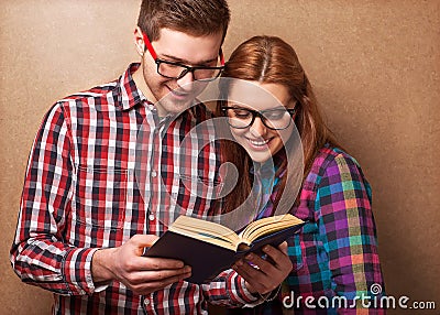 Hipsters reading a book. Stock Photo