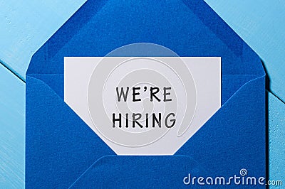 We are hiring phrase written in the paper at blue envelope. human resources concept Stock Photo