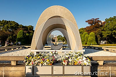 The Hiroshima Victims Memorial Cenotaph with view of Atomic Bomb Dome JAPAN Editorial Stock Photo