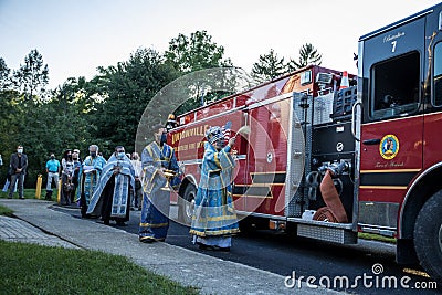 His Eminence, Archbishop Michael of NY and NJ, offers prayers for victims of Covid-19 and 9/11/2001, and firetruck blessing Editorial Stock Photo