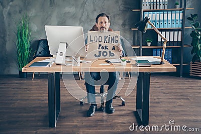 His he fired miserable depressed desperate poor agent broker guy holding in hands promo placard looking job economy Stock Photo