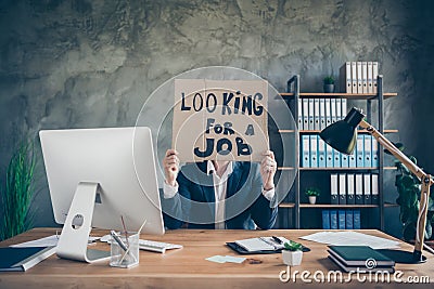 His he fired poor finance agent broker guy holding in hands promo placard hiding face looking new chance job economy Stock Photo