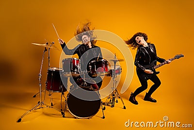 His he her she nice attractive fashionable excited cheerful cheery overjoyed couple playing music bass sound fame Stock Photo