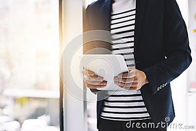 His tablet is a work machine. a businessman using a digital tablet in a modern office. Stock Photo